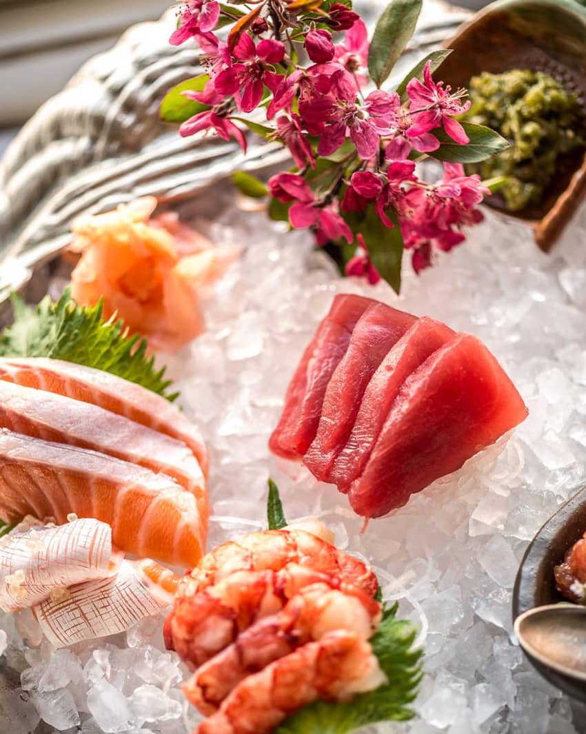 Tuna and salmon sashimi on plate of ice