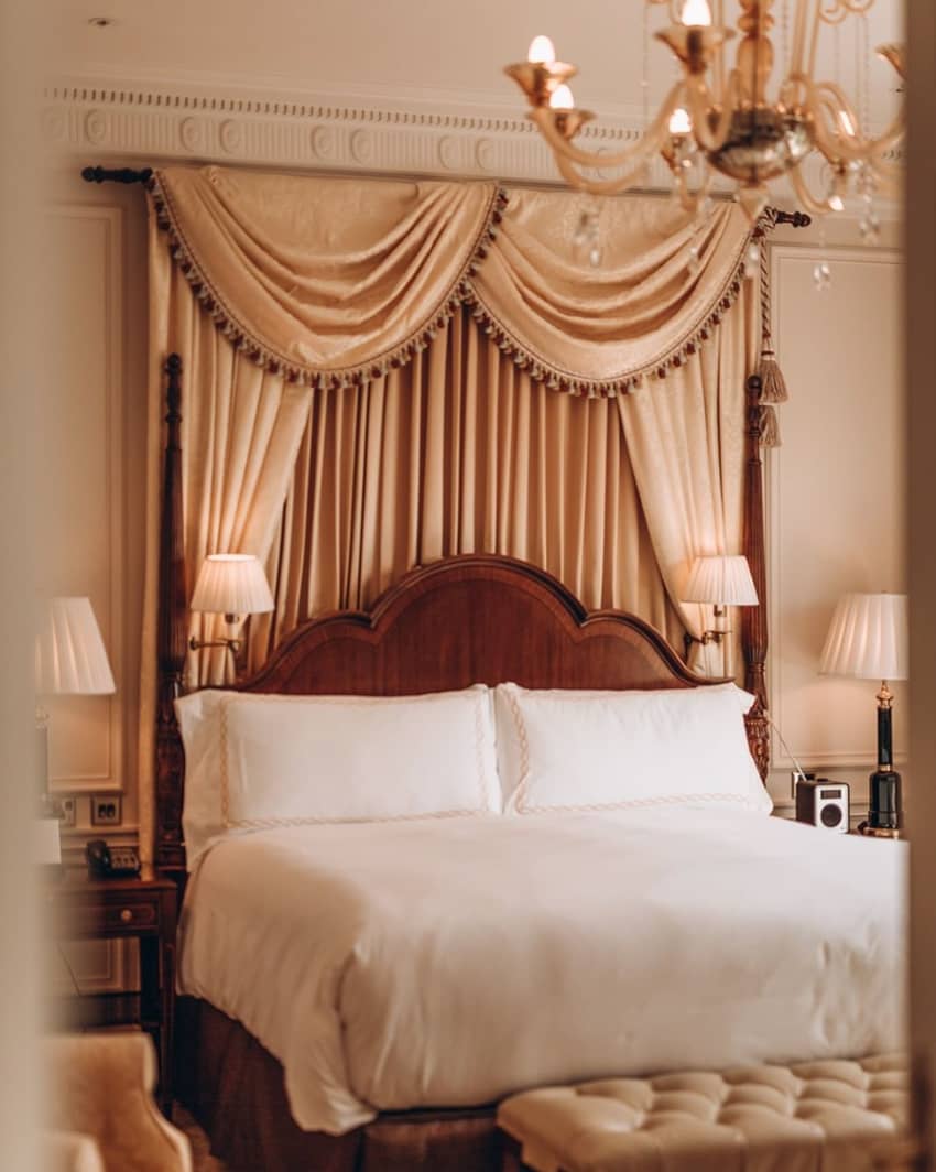 the savoy london bed with oldschool curtains behin