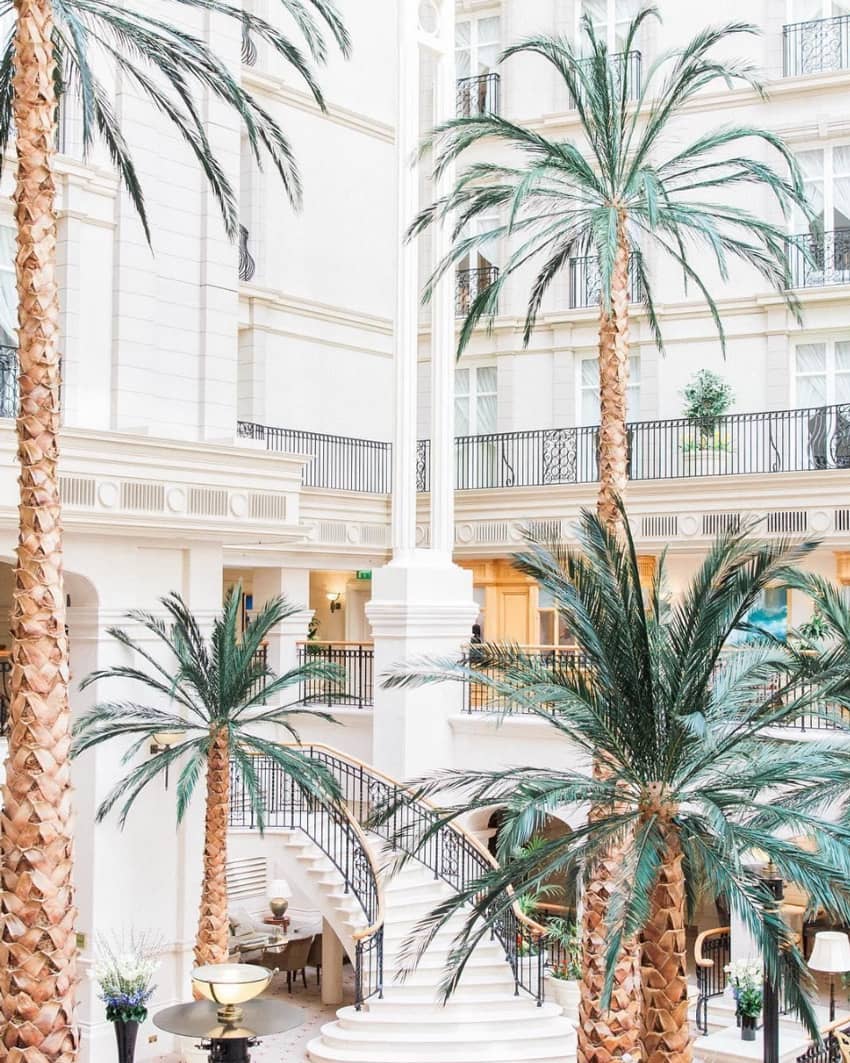 the landmark london lobby with palmtrees