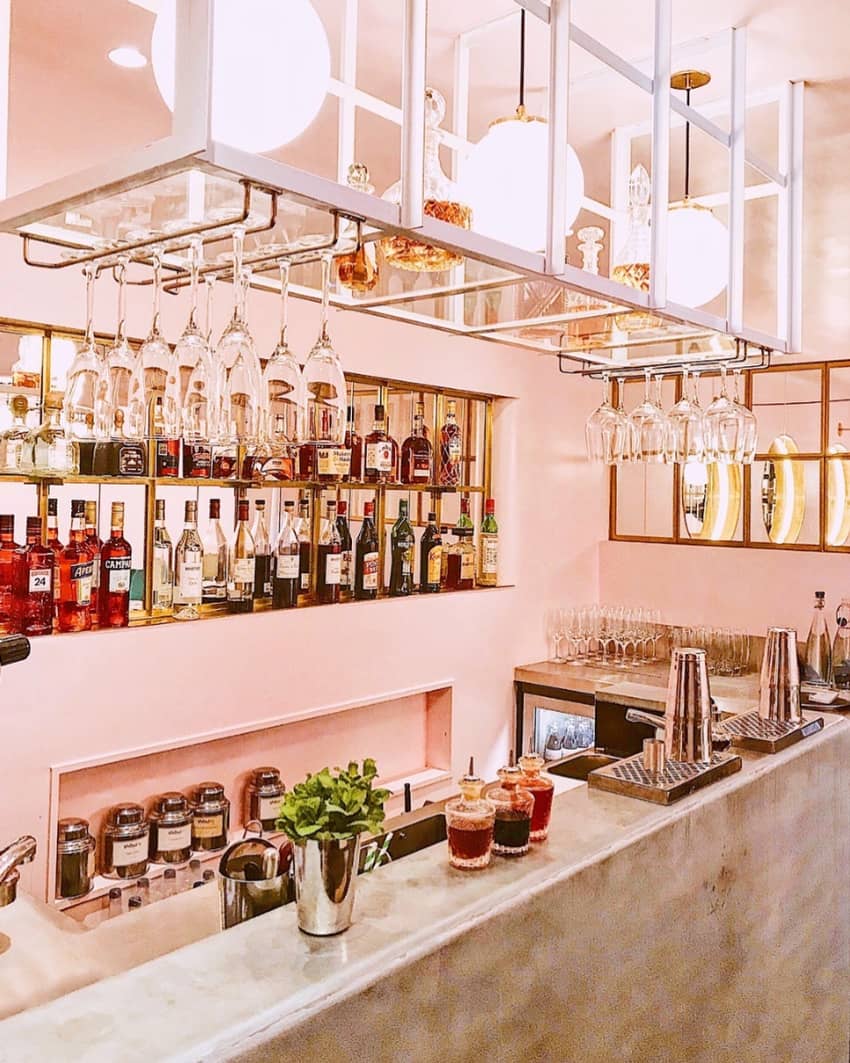 nac mayfair light pink colored bar with bottles