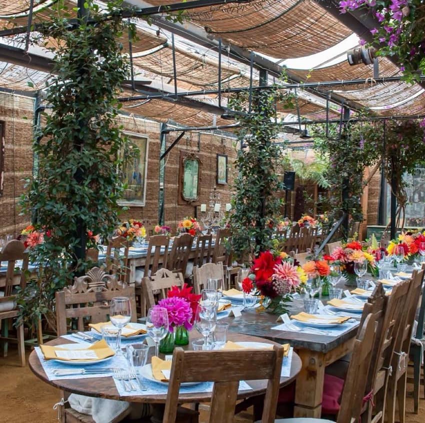 petersham nurseries plant interior with colorful set tables