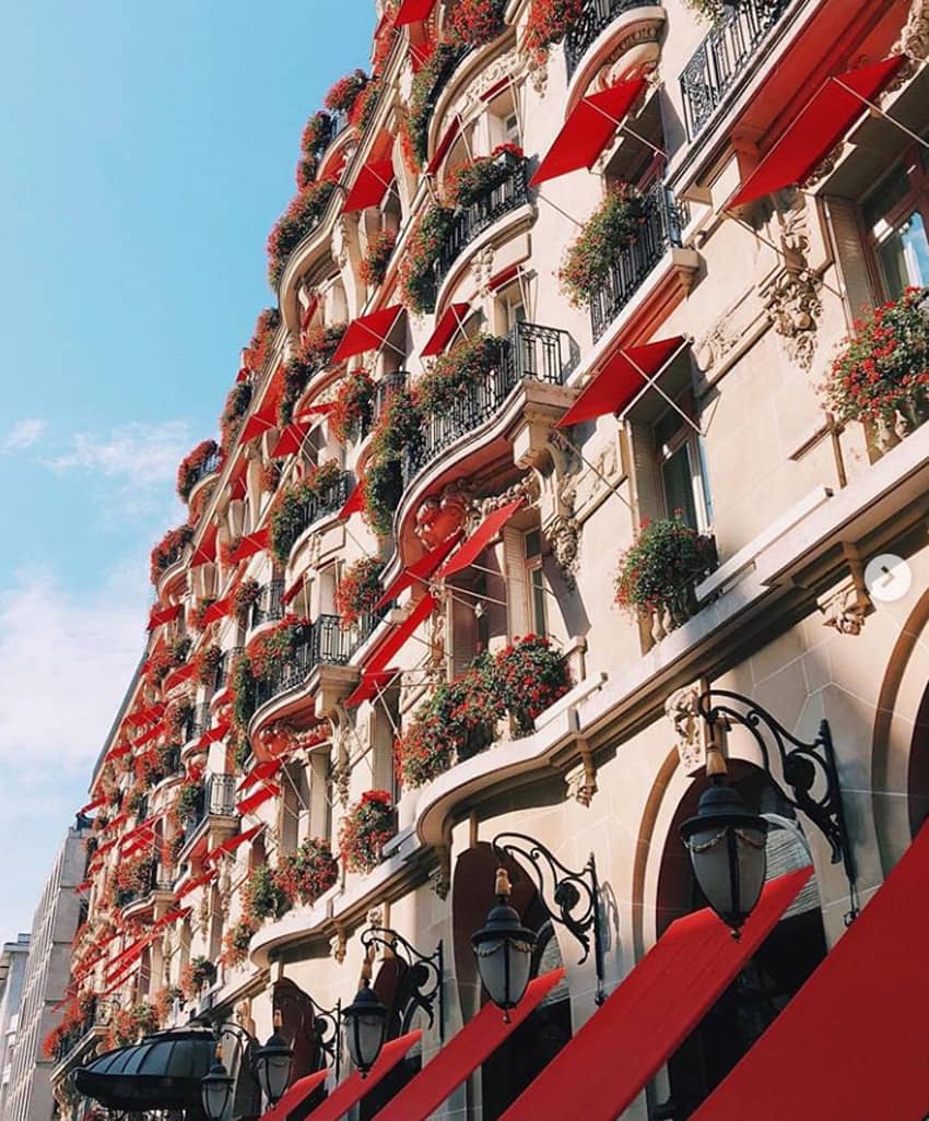 Hotel Plaza Athenee iconic red awning red geraniums