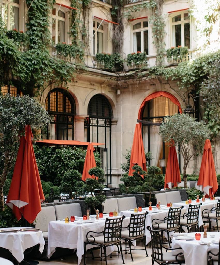 Hotel Plaza Athenee inner courtyard closed red parasols
