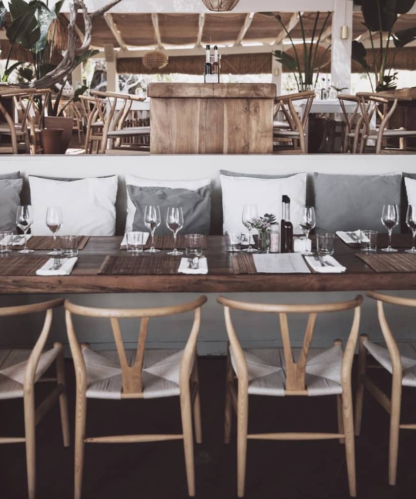 El Chiringuito Ibiza wooden table white grey cushions