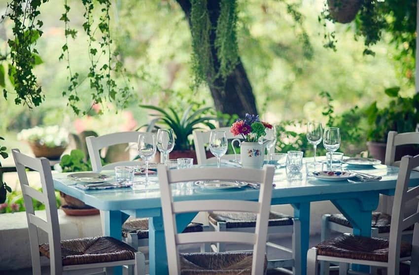 La Paloma light blue table under shade tree