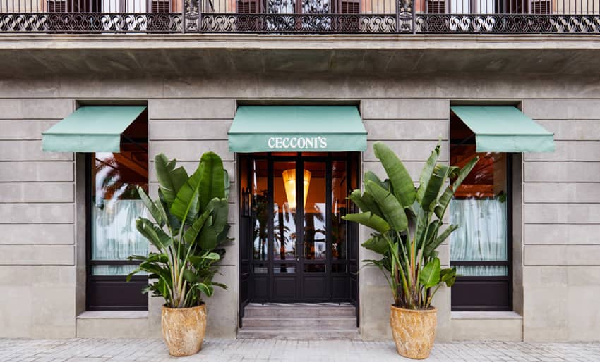Cecconis entrance green awning faux banana plants