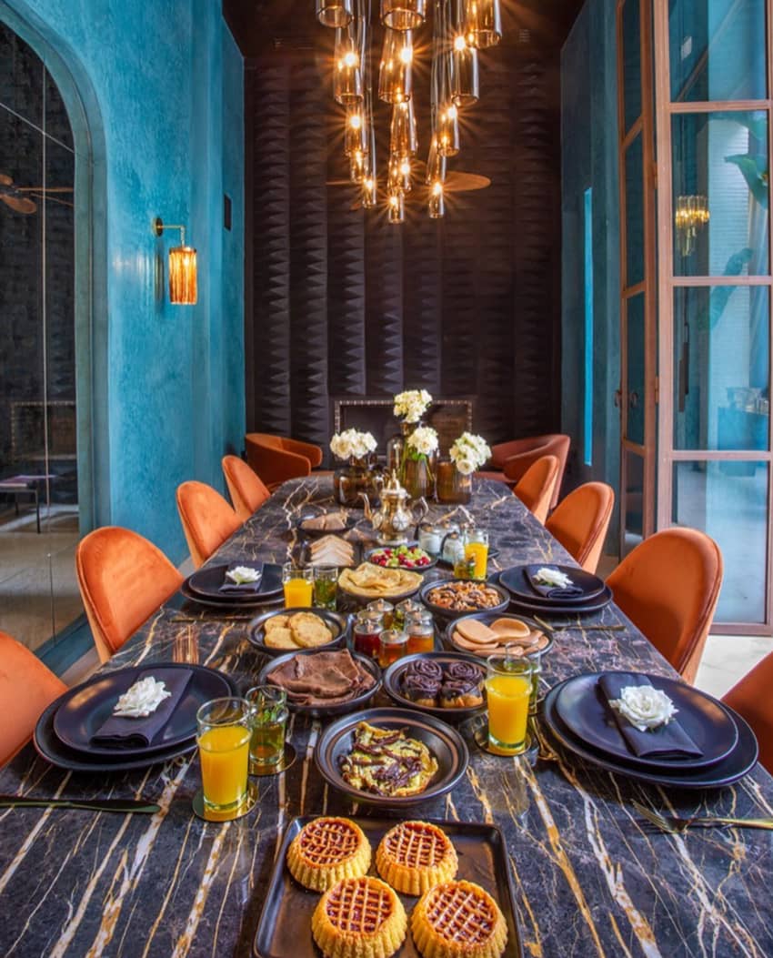 Riad Tajania table feast orange chairs