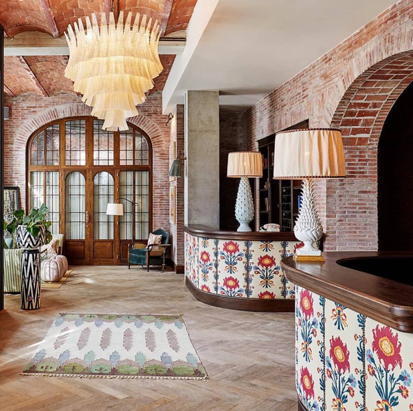 Soho House Barcelona concierge desks layered chandelier