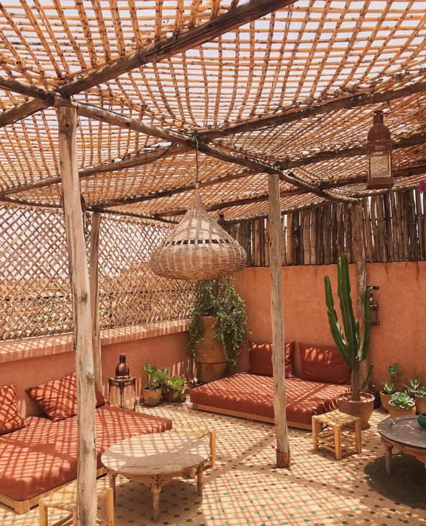 rooftop rust colored daybeds wooden pergola