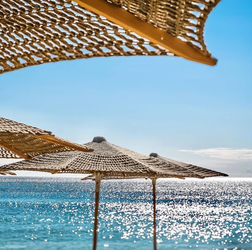 Byblos Beach woven parasols sea view