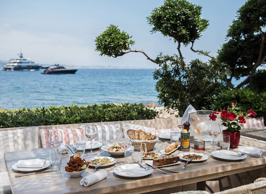 La Guerite Cannes sunny day table feast sea view