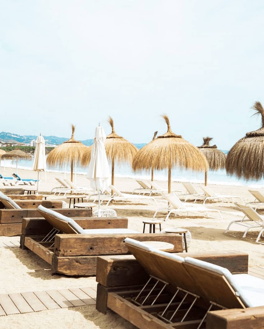 El Chiringuito Marbella wooden loungers on the beach