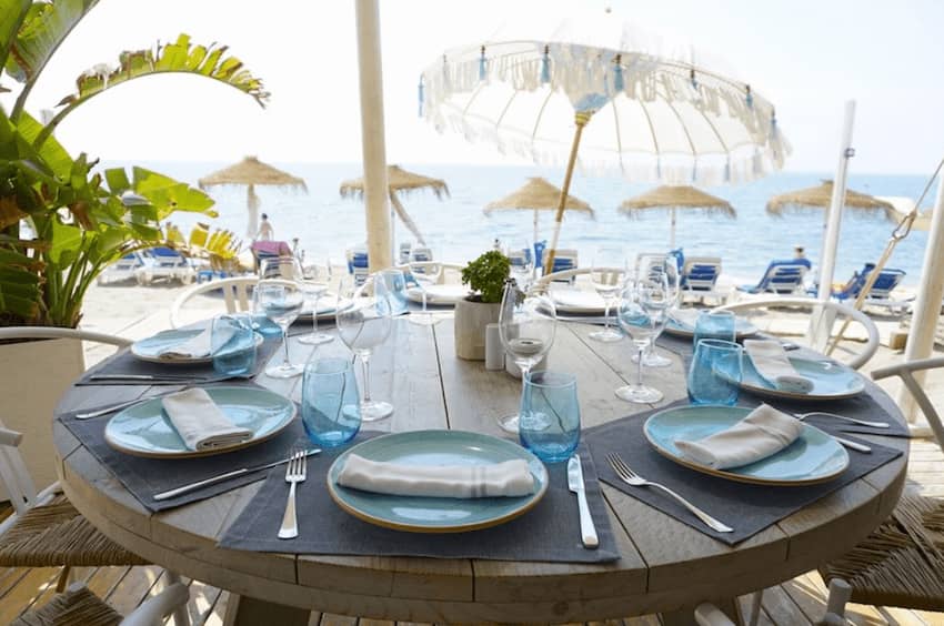 La Milla Marbella outdoor dining round wooden table