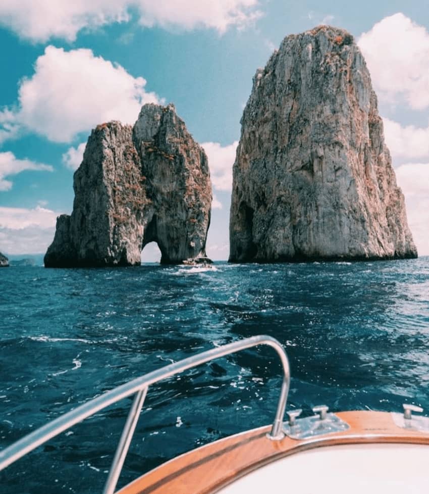 sea journey yacht overlooking rock formations