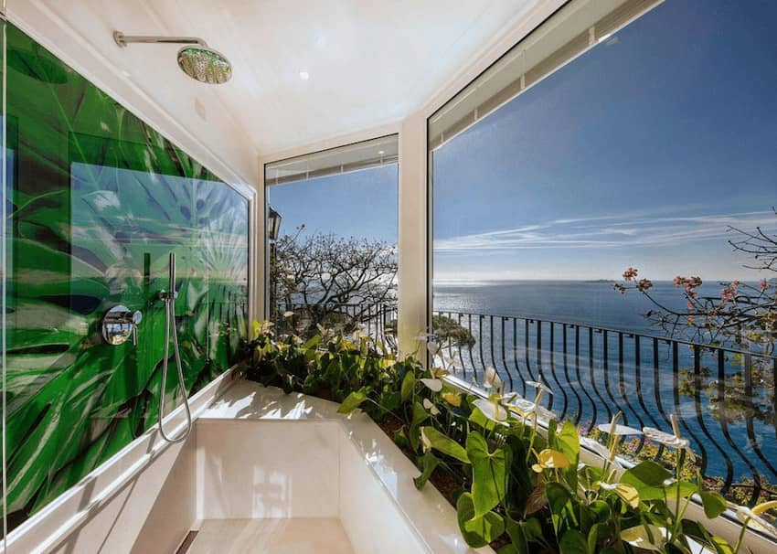 shower bathtub glass windows tropical plants sea view