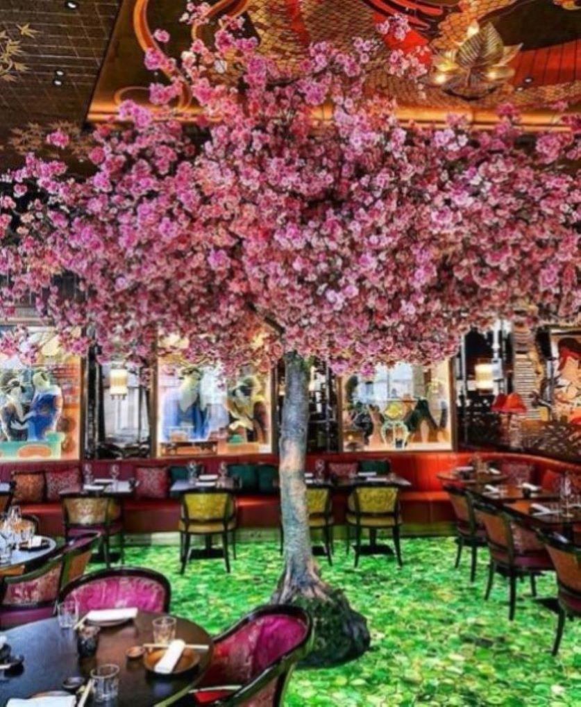 Ivy Asia London blooming sakura tree centerpiece painted glass walls