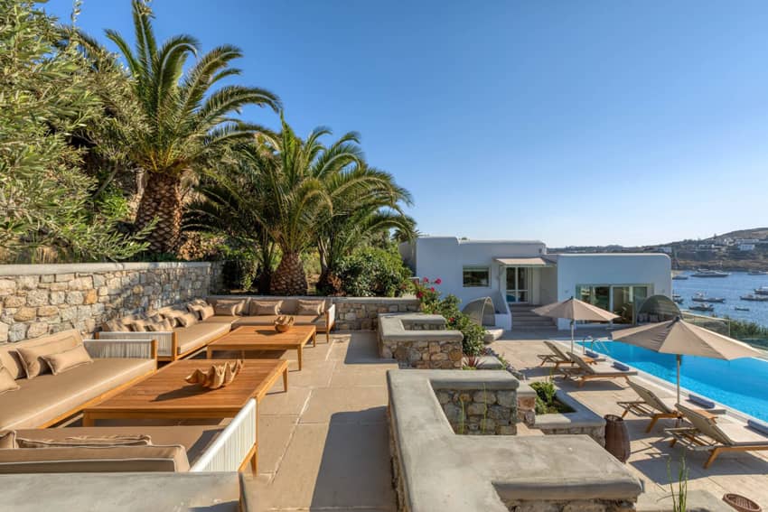 garden palm trees turquoise villa pool