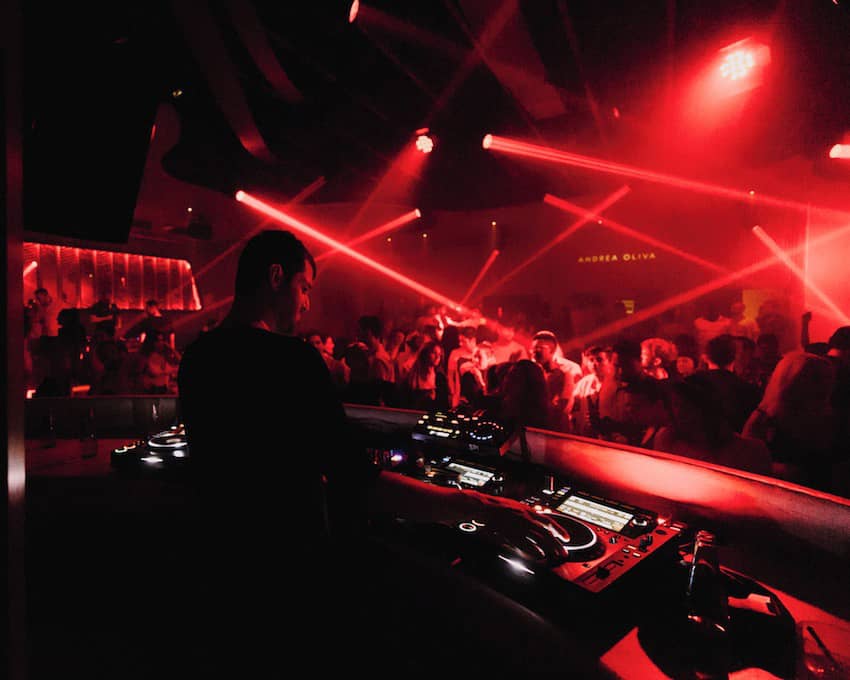 live dj nightclub scene red laser lights