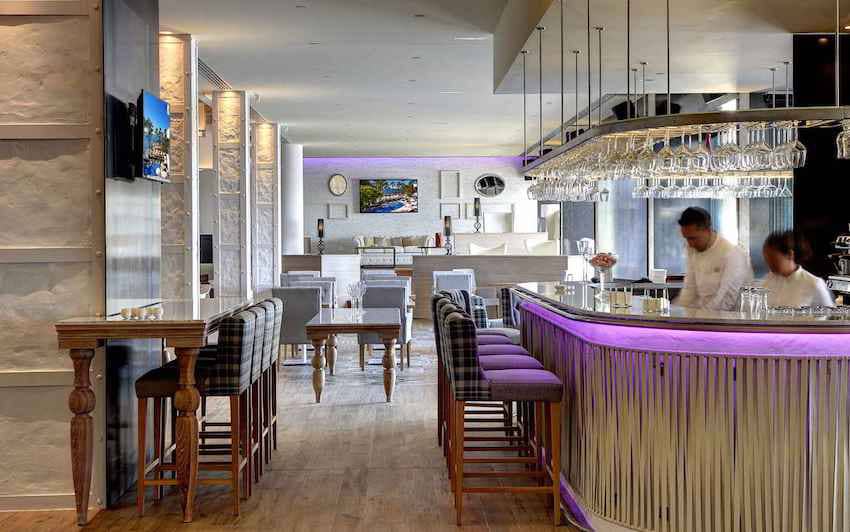 purple lighted cocktail bar dining room
