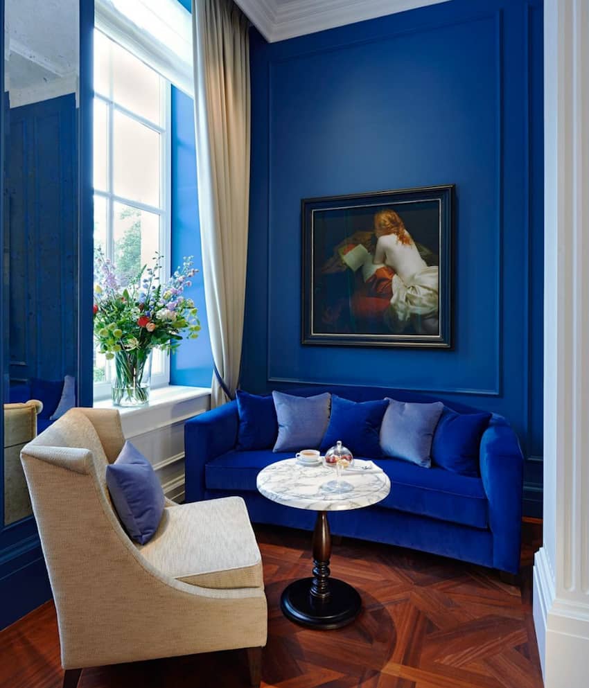seating area royal blue tones painting on wall