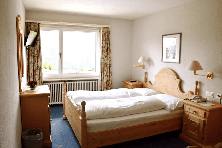 hotel bedroom wooden bed