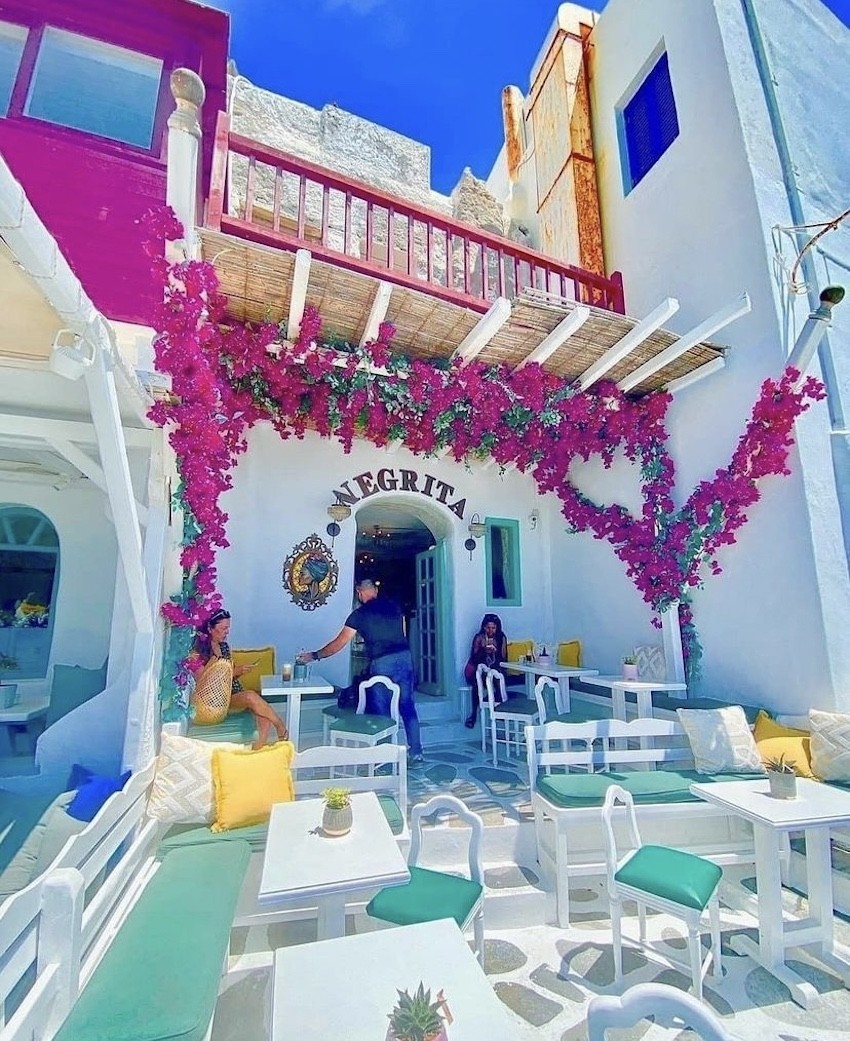 Negrita Mykonos secret terrace pink blue yellow