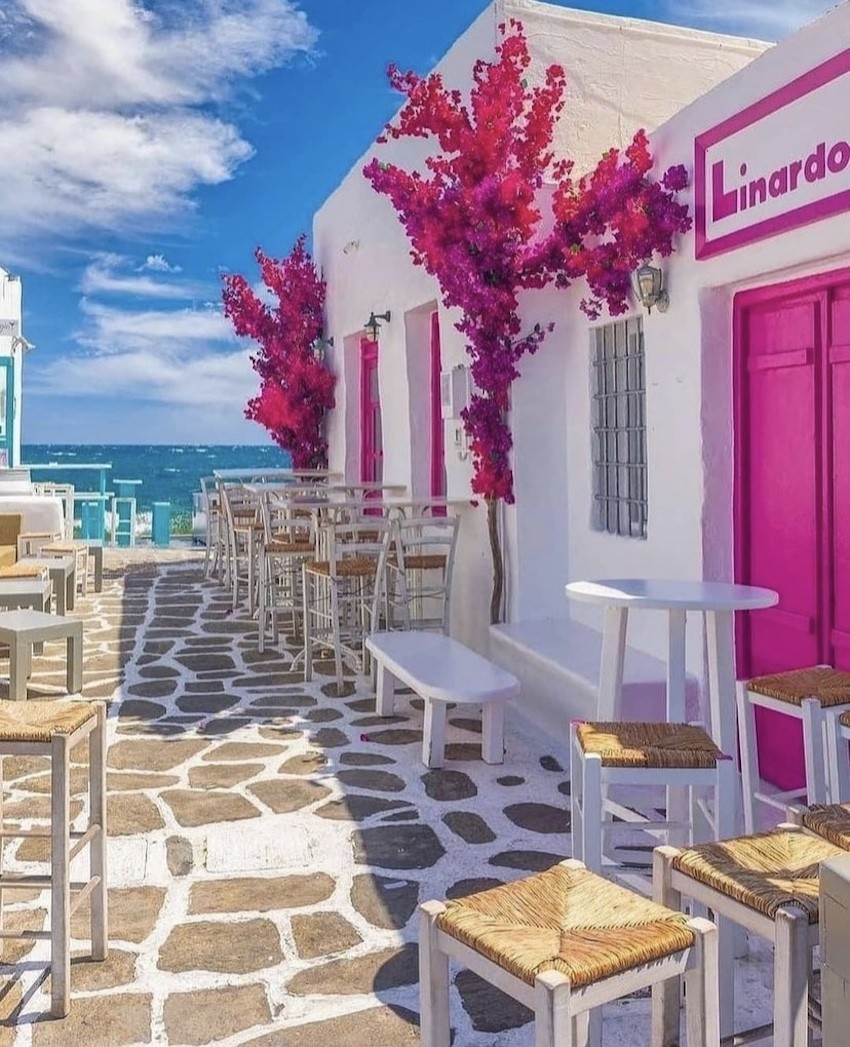 Negrita Mykonos terrace pink door and flowers