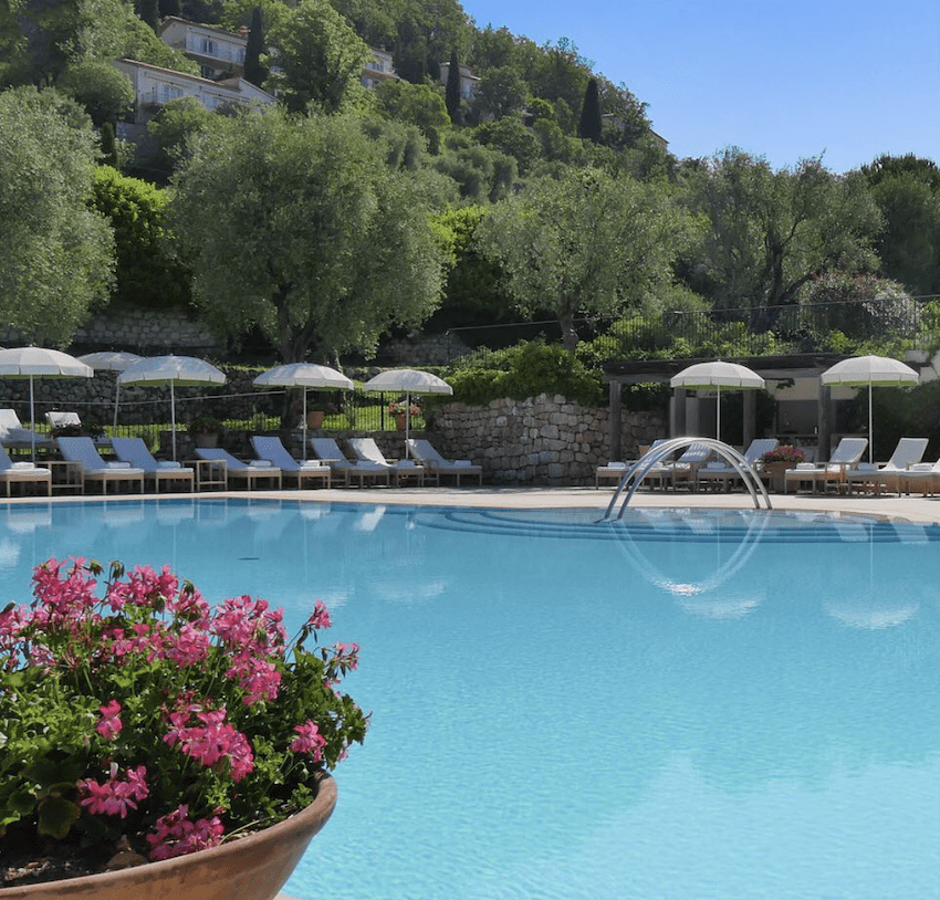 hotel pool sunbeds flowers