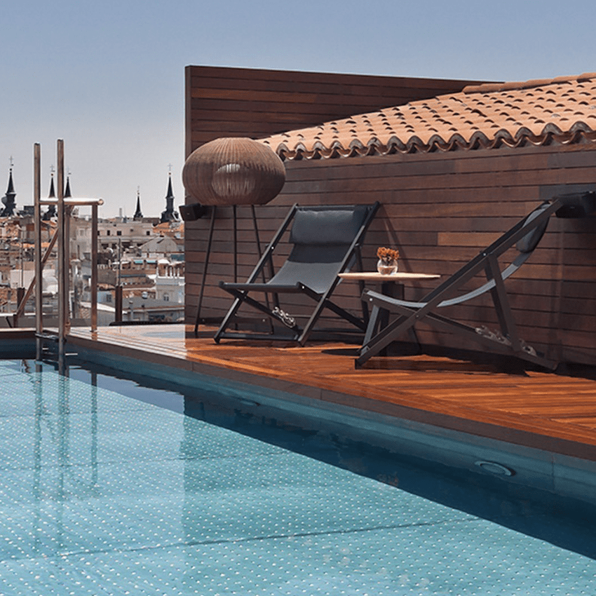 poolside wooden terrace sun chairs