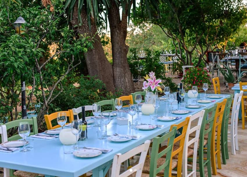 light blue painted table white green yellow chairs